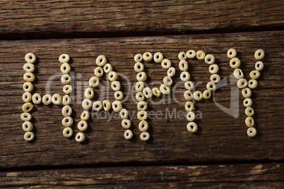 Cereal rings arranged happy text