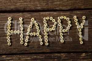 Cereal rings arranged happy text