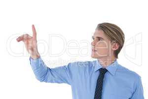 Young businessman using invisible imaginary interface