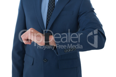 Mid section of businessman wearing wrist watch