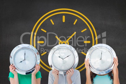 Women holding a clock against background with clock