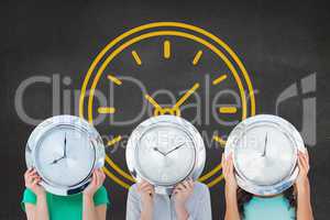 Women holding a clock against background with clock