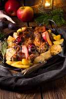 Chicken pieces with fruit and vegetables from the oven