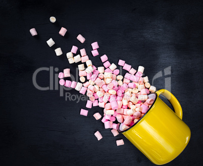 yellow mug with multicolored marshmallow