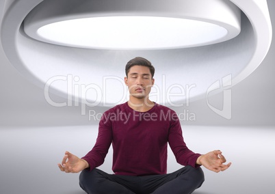 Man meditating in futuristic space