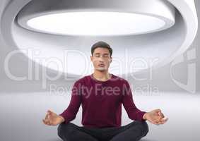 Man meditating in futuristic space