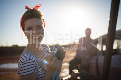 Woman holding a vintage camera