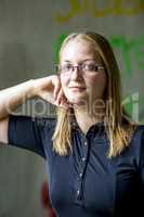 Portrait of a young woman with glasses