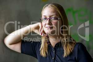 Portrait of a young woman with glasses