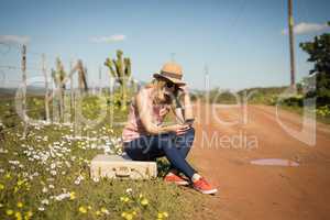 Woman using mobile phone on a sunny day