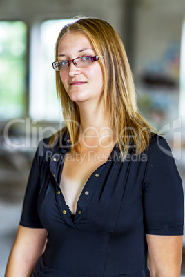 Portrait of a young woman with glasses