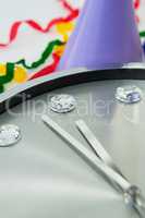 Clock and streamers against white background