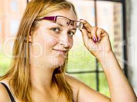 Portrait of a young woman with glasses