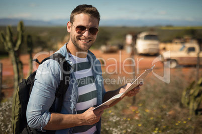 Man looking at map on a sunny day