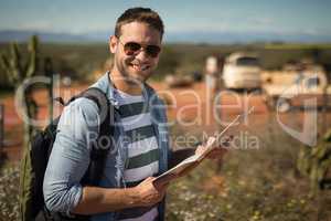 Man looking at map on a sunny day