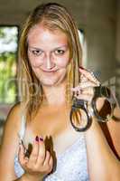 Young woman with handcuffs