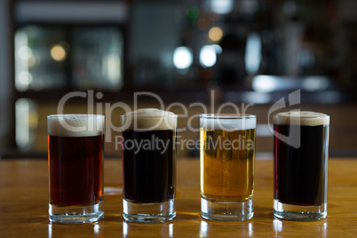 Close-up of beer glasses on the counter