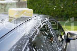Soaked wet sponge kept on roof of car