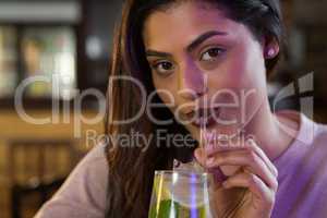 Beautiful woman sipping on a drink