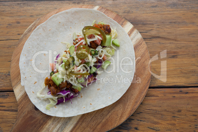 Mexican taco on wooden tray