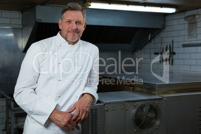 Male chef standing in commercial kitchen