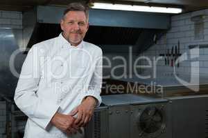 Male chef standing in commercial kitchen