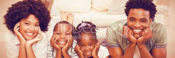 Happy family lying on the floor