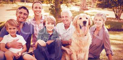 Happy family smiling with dog