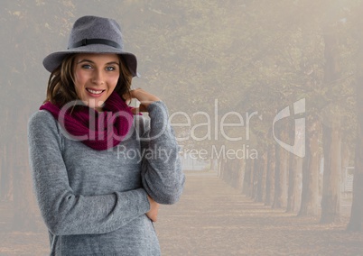 Woman in Autumn with hat and scarf in forest