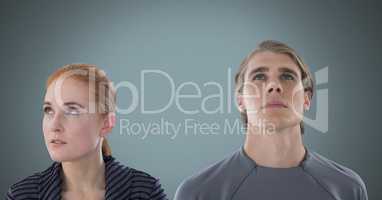 Man and woman looking up with grey background