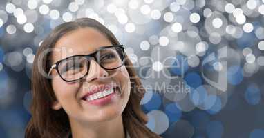 Woman looking up with sparkling background