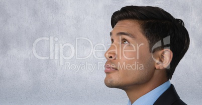 Man looking up with grey background