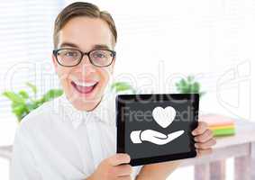 Man holding tablet with hand giving heart love