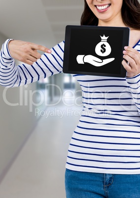 Woman holding tablet with charitable hand giving money bag