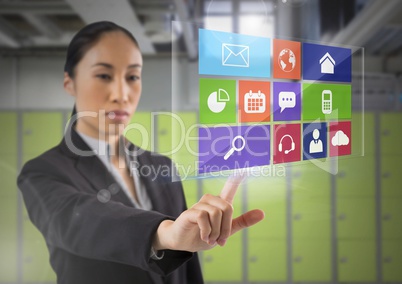 App interface and Businesswoman touching air in front of lockers