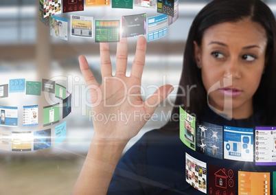 Screens rotating interface and Businesswoman opening hand in front of windows in large hall