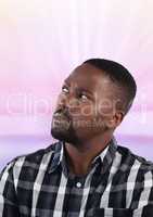 Man looking up with pink background