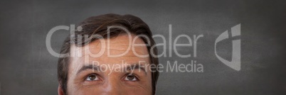 Man looking up with dark stone background