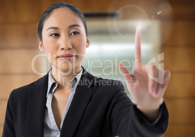 Businesswoman touching air in front of lift