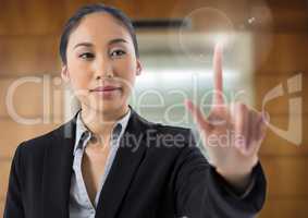 Businesswoman touching air in front of lift