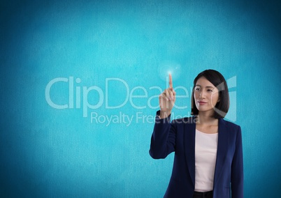 Businesswoman touching air in front of blue background