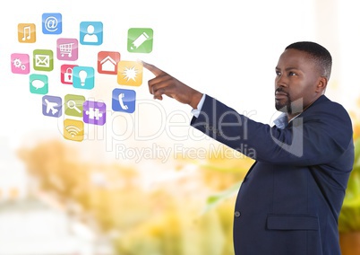 App interface and Businessman pointing touching air in front of greenery