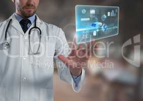Information interface and Doctor man touching air in front of blurred background