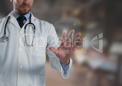 Doctor man touching air in front of blurred background