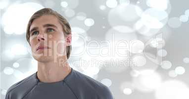 Man looking up with sparkling background