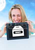 Woman holding tablet with donate box icon