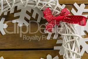 Cropped image of wreath decoration on artificial snow flake