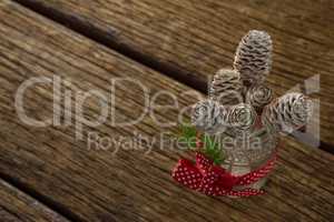 High angle view of pine cones in glass jar