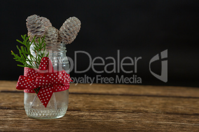 Close up of pine cones in glass jar