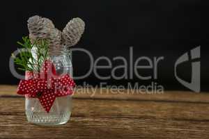 Close up of pine cones in glass jar
